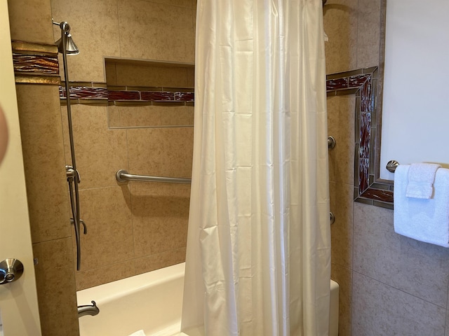 bathroom with shower / bathtub combination with curtain