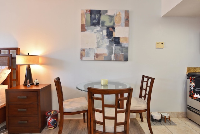 dining space with light tile patterned floors