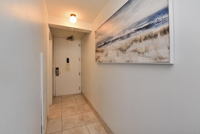 hallway featuring light tile patterned flooring