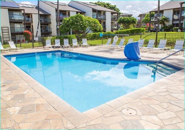 view of swimming pool with a patio area