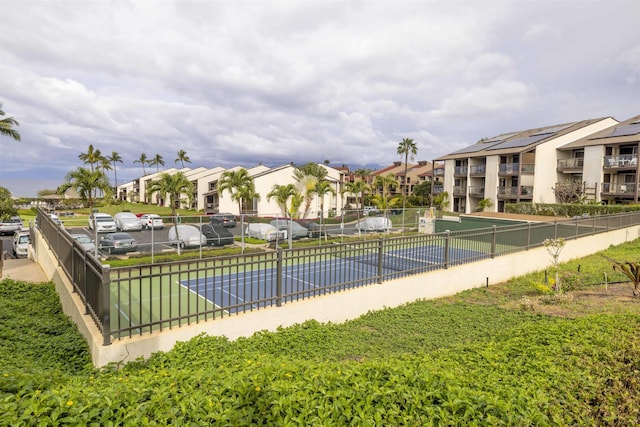 view of pool with tennis court