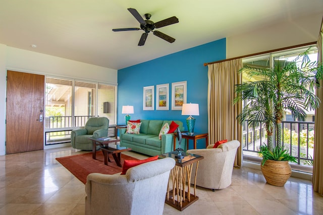 living room with ceiling fan and light tile patterned floors