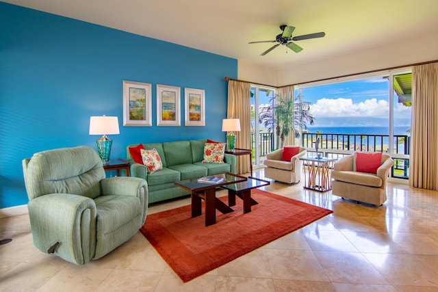 tiled living room featuring a water view and ceiling fan