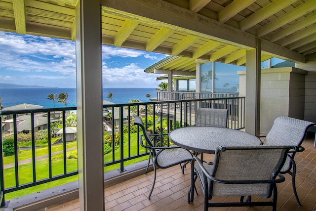 balcony featuring a water view