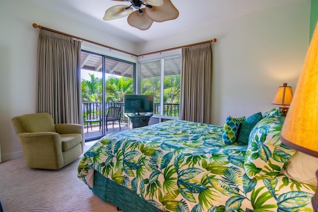 bedroom featuring access to exterior, ceiling fan, and multiple windows