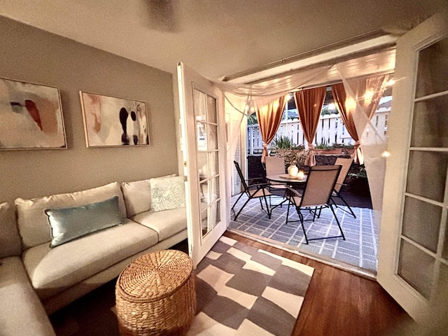 living room featuring wood finished floors and french doors