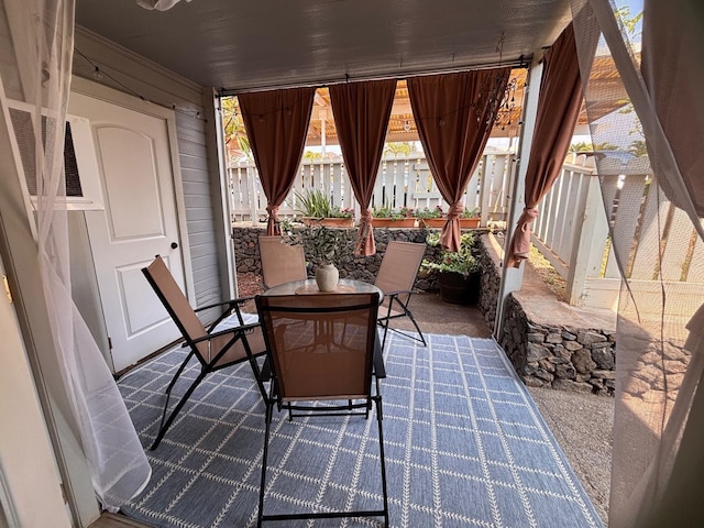 view of patio / terrace with outdoor dining space and fence