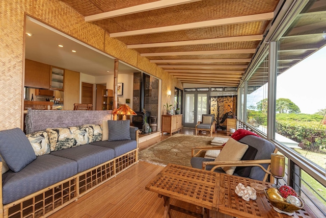 1195 Omaopio Rd Unit A, Kula, HI 96790 - sunroom with wood-type flooring, a wood stove, and french doors