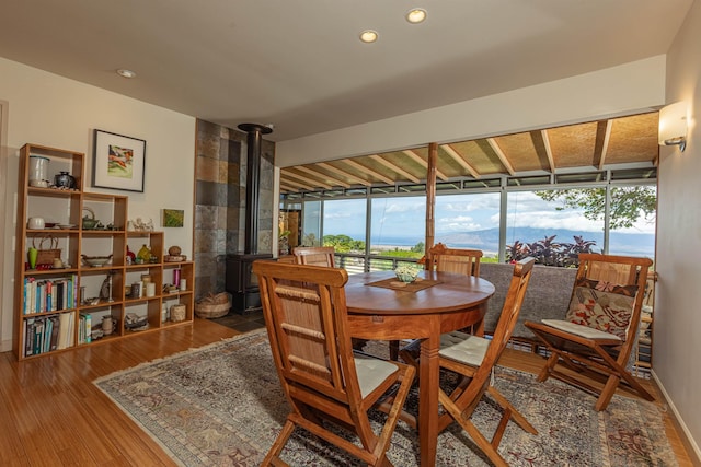 1195 Omaopio Rd Unit A, Kula, HI 96790 - dining room featuring a wood stove, wood finished floors, and recessed lighting