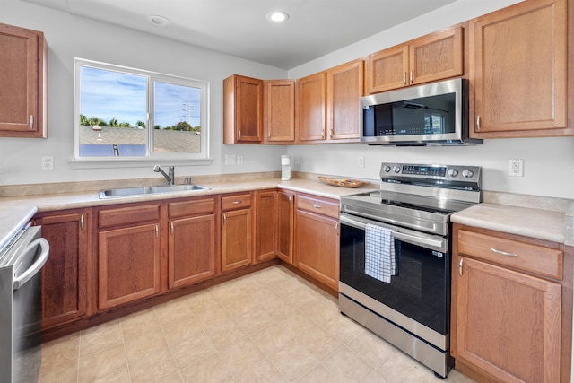 kitchen with sink and appliances with stainless steel finishes