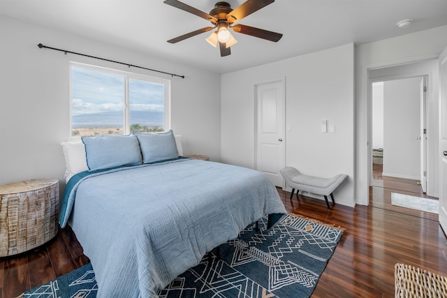 bedroom featuring ceiling fan and dark hardwood / wood-style flooring