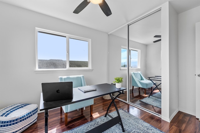 office space with dark wood-type flooring and ceiling fan