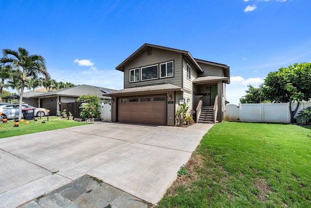 view of front of house with a front yard and a garage