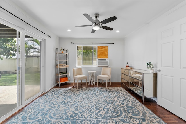 living area featuring crown molding, cooling unit, ceiling fan, and dark hardwood / wood-style flooring