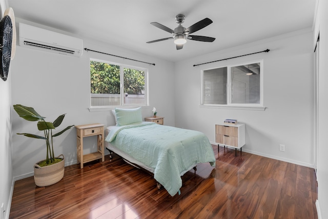 bedroom featuring dark wood-type flooring, ceiling fan, and a wall mounted AC