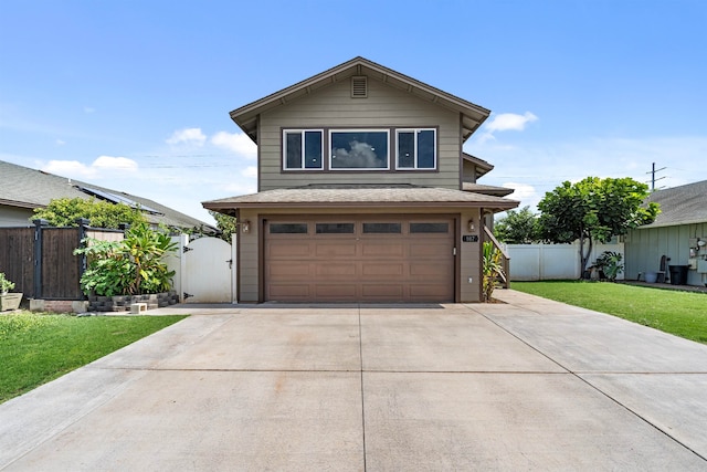 front of property featuring a garage and a front lawn