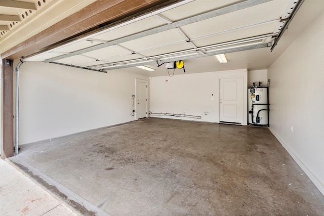 garage with a garage door opener and gas water heater