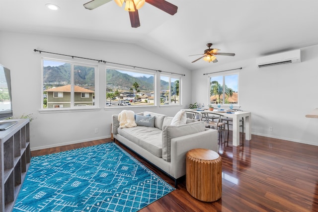 living room featuring a mountain view, a wall mounted AC, vaulted ceiling, and dark hardwood / wood-style flooring