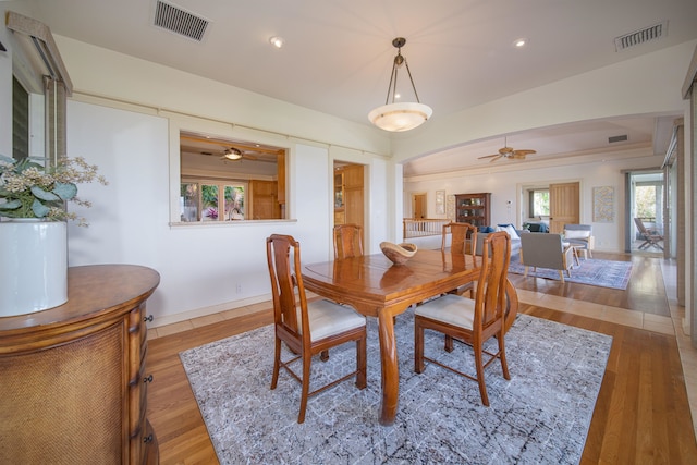 dining area featuring ceiling fan and light hardwood / wood-style floors