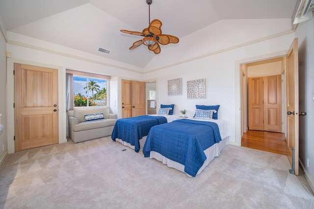 carpeted bedroom with lofted ceiling and ceiling fan