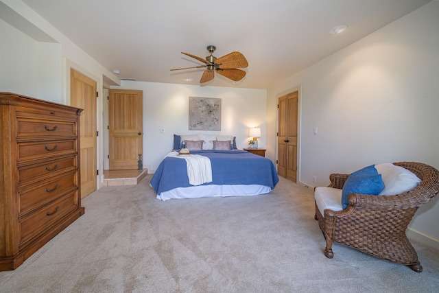 carpeted bedroom featuring ceiling fan