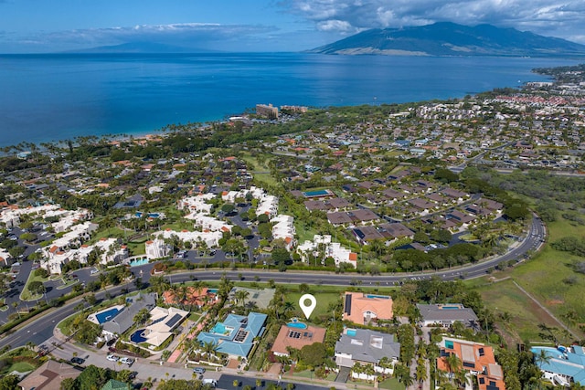 birds eye view of property featuring a water and mountain view