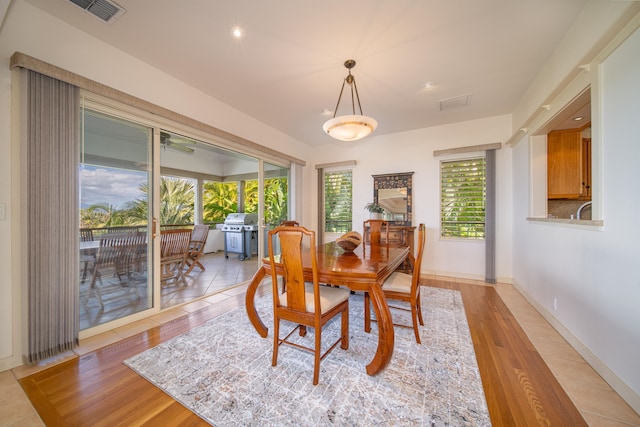 dining space featuring light hardwood / wood-style flooring