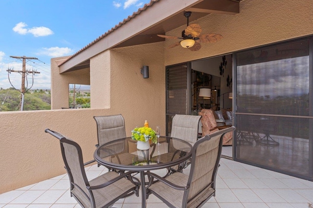 view of patio featuring ceiling fan and a balcony