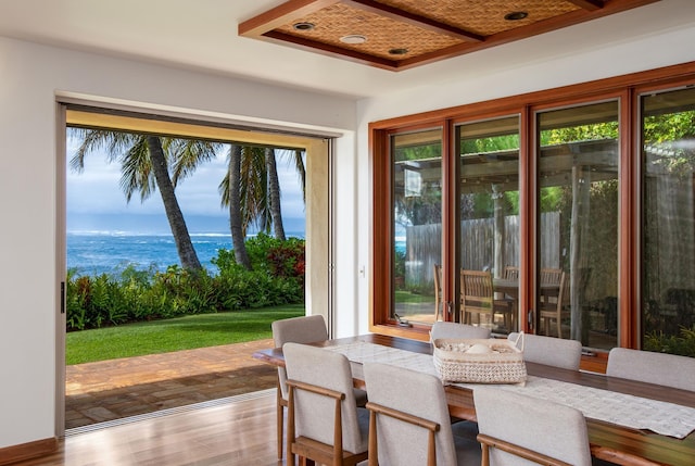 doorway featuring a water view and wood finished floors