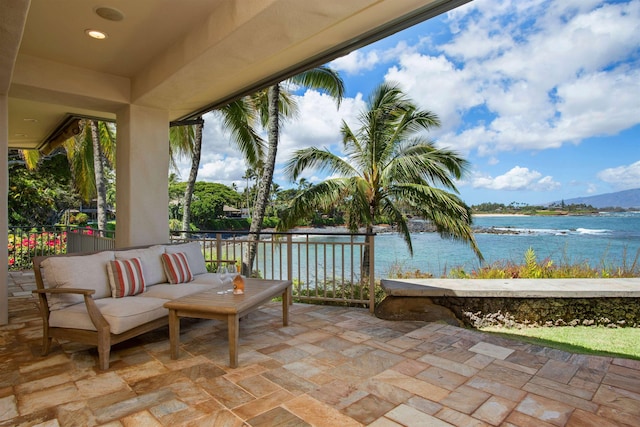 view of patio / terrace with an outdoor hangout area and a water view