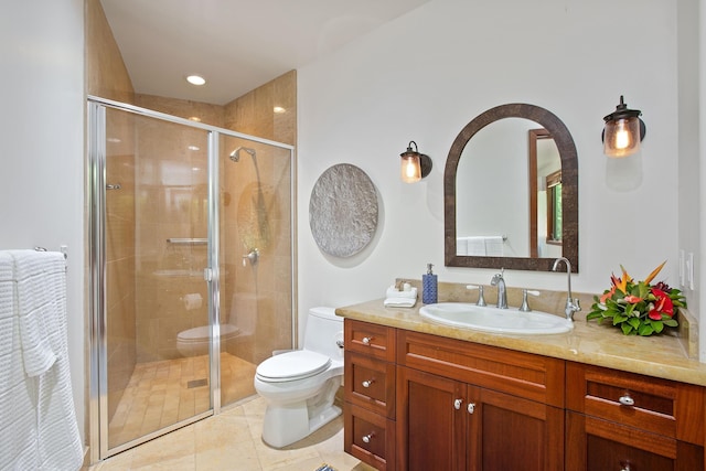 full bath with vanity, a shower stall, and toilet