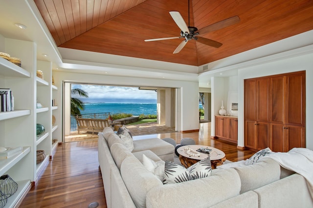 living area with lofted ceiling, ceiling fan, a water view, wood finished floors, and wood ceiling