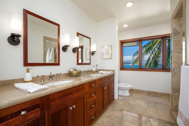 bathroom featuring double vanity, recessed lighting, a bidet, a sink, and baseboards