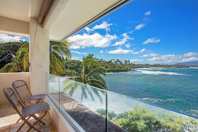 balcony featuring a water view