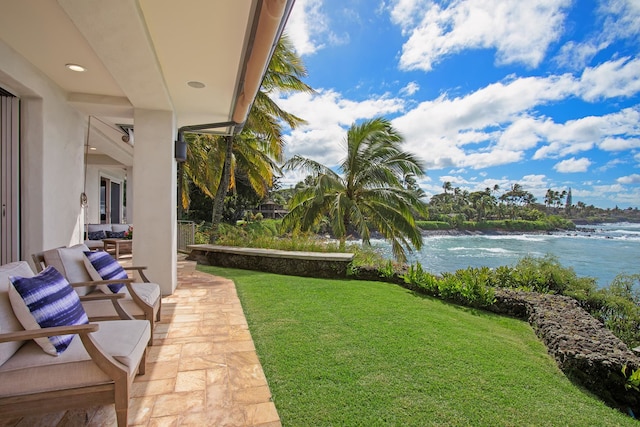 view of yard featuring a water view and a patio area