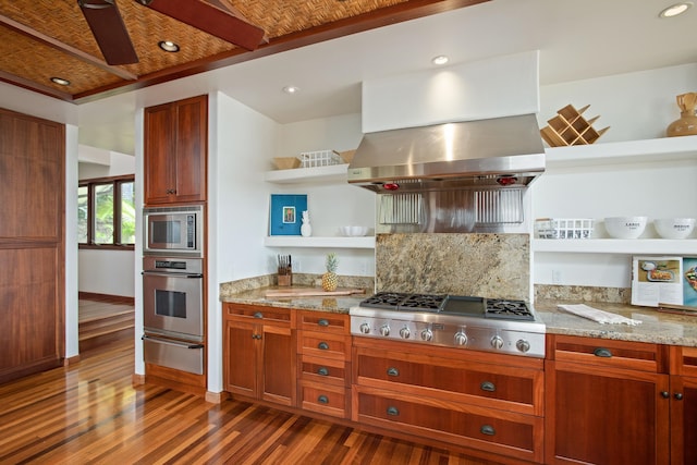 kitchen featuring decorative backsplash, stainless steel appliances, dark hardwood / wood-style floors, and light stone countertops