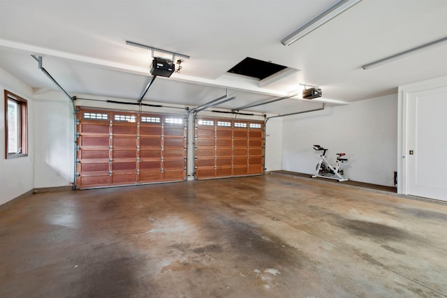 garage featuring a garage door opener