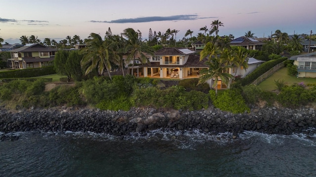 aerial view at dusk with a water view