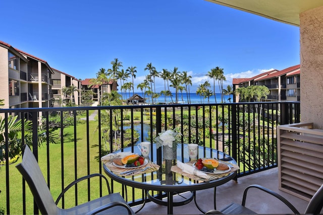 balcony featuring a water view