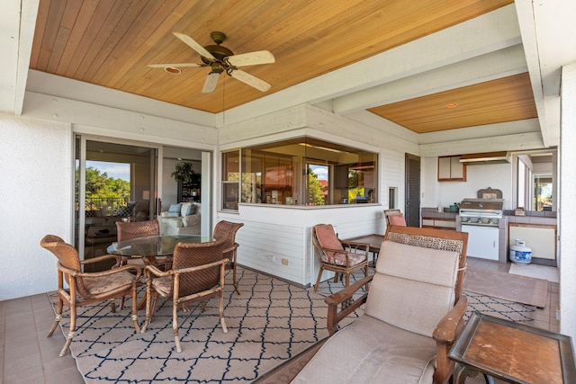 view of patio featuring an outdoor kitchen, grilling area, and ceiling fan