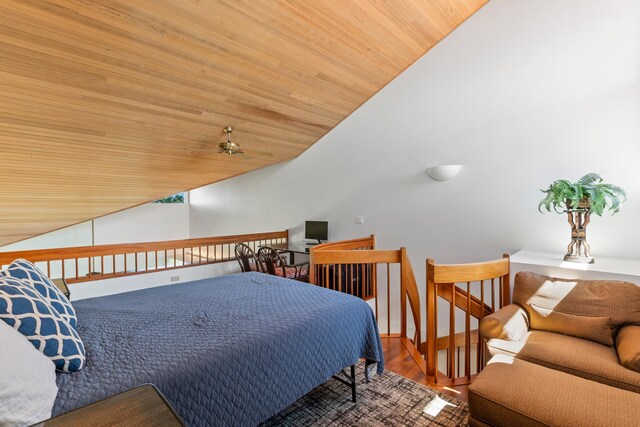 bedroom with high vaulted ceiling, wooden ceiling, and wood-type flooring