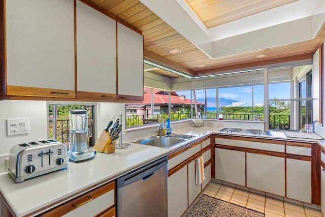 kitchen featuring sink, wood ceiling, white cabinetry, stainless steel appliances, and light tile patterned floors