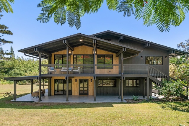 965 Hog Back Rd Unit 1, Haiku, HI 96708 - back of property featuring a patio area, a lawn, french doors, and board and batten siding