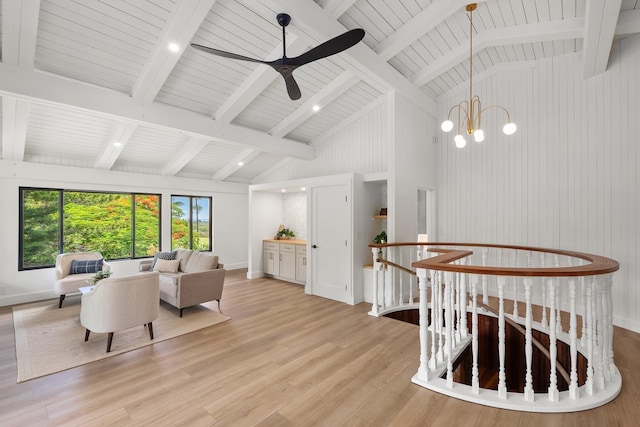 965 Hog Back Rd Unit 1, Haiku, HI 96708 - living area featuring light wood finished floors, beamed ceiling, high vaulted ceiling, ceiling fan, and a chandelier