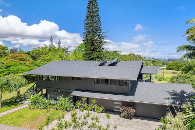 965 Hog Back Rd Unit 1, Haiku, HI 96708 - view of front of house featuring roof with shingles, stairway, and driveway