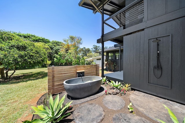 965 Hog Back Rd Unit 1, Haiku, HI 96708 - patio / terrace with a lawn