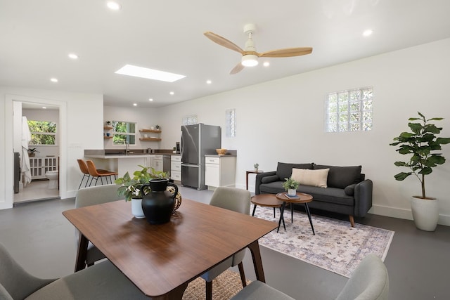 965 Hog Back Rd Unit 1, Haiku, HI 96708 - dining space featuring finished concrete flooring, recessed lighting, healthy amount of natural light, a skylight, and ceiling fan