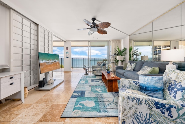 living room featuring a wall of windows and ceiling fan