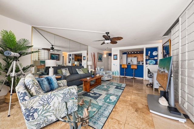 tiled living room with ceiling fan