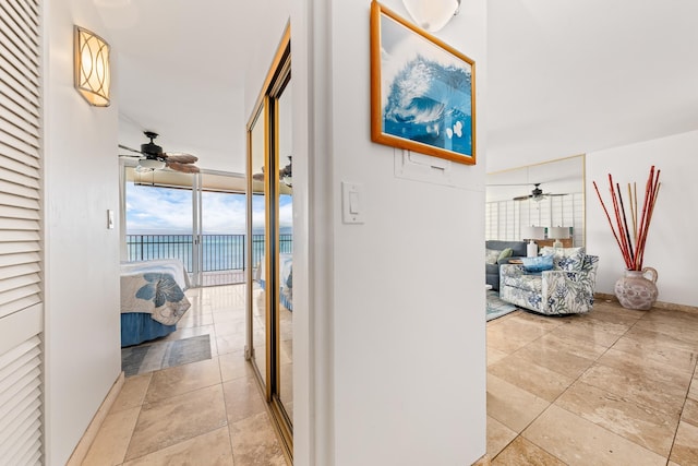 hallway featuring expansive windows